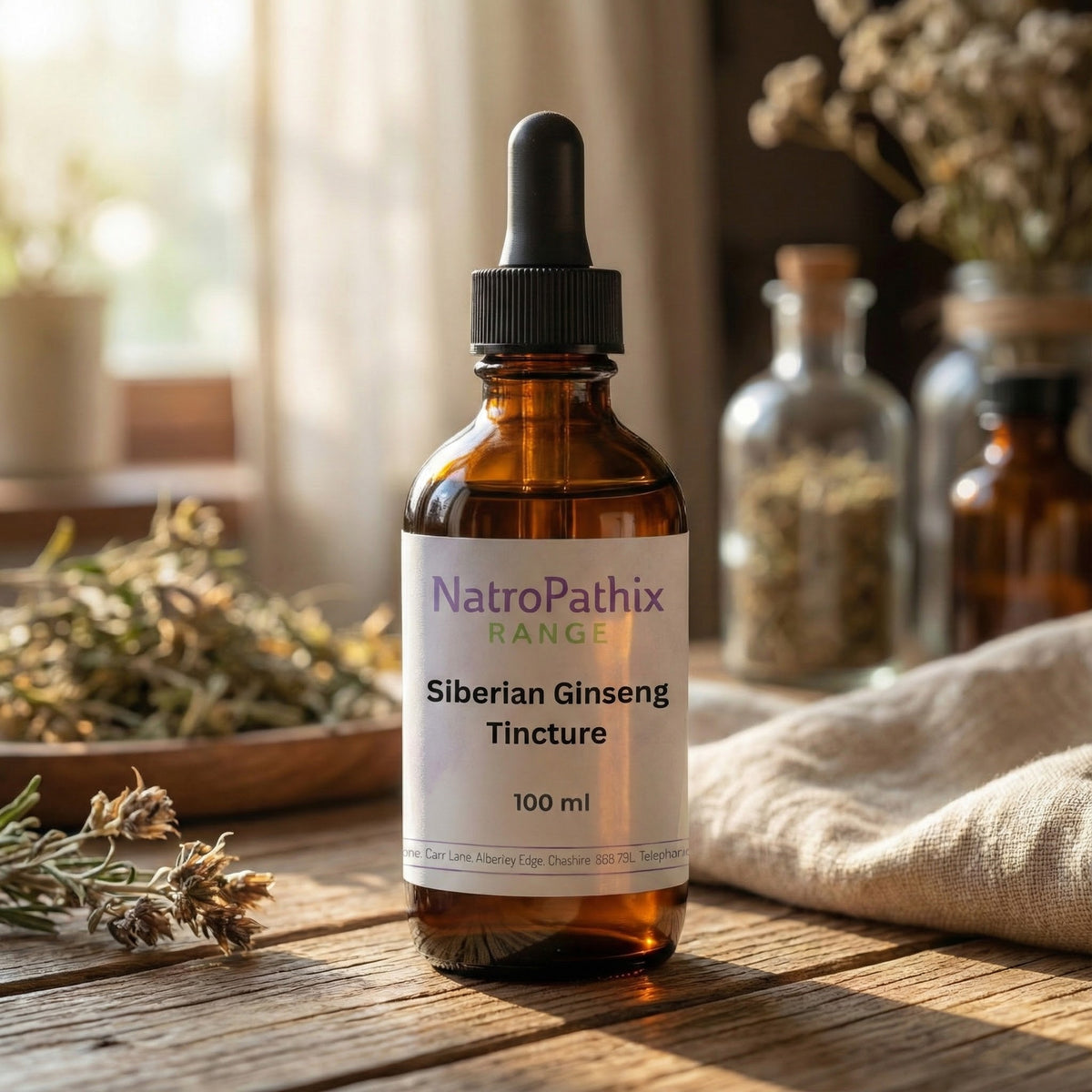 An amber dropper bottle labeled "Siberian Ginseng" sits on a wooden table with herbs and sunlight, ideal for adrenal support and as a natural immune booster.