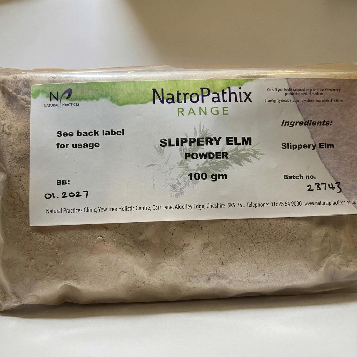 A 100g packet of Slippery Elm Powder, designed to support digestive health, with a label listing ingredients and expiry date.