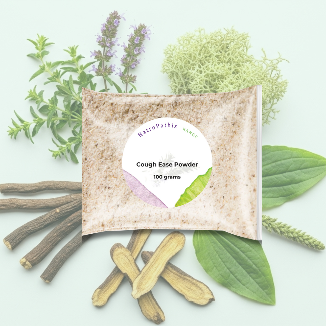 A 100g packet of Cough-Ease Powder surrounded by healing herbs and roots, highlighting this herbal remedy for soothing relief from dry cough.