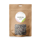 Brown resealable bag labeled "Uterine Tea - 100gms" features a clear window displaying loose herbal tea, carefully blended to support uterine health and women’s wellness.