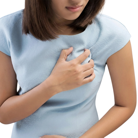 Woman in a light blue dress clutching her chest, possibly indicating discomfort that could be relieved with PMT & Tender Breasts Combination.