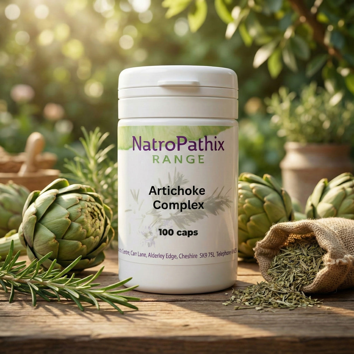A bottle of Artichoke Complex - 100 Capsules, formulated for liver health and digestion support, is displayed outdoors among fresh artichokes and herbs.