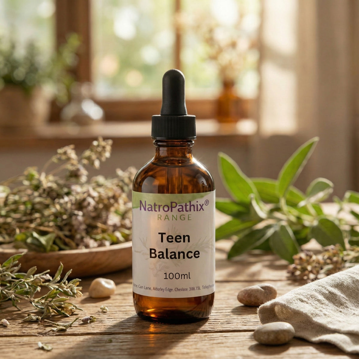 Teen Balance 100ml tincture bottle surrounded by herbs