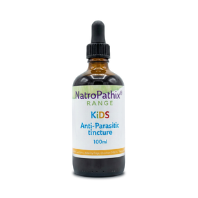 A brown glass dropper bottle labeled "Anti-Parasitic Tincture For Kids" sits on a white background, offering a natural herbal remedy specifically formulated to help eliminate parasites in children.