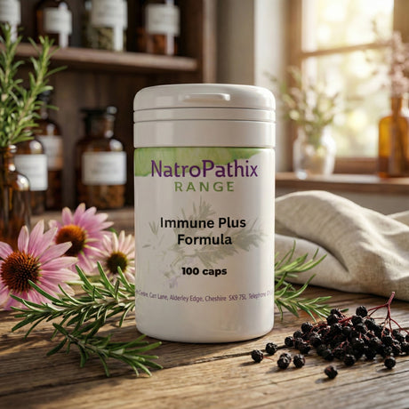 A bottle of Immune Plus - 100 Capsules rests on a wooden table with herbs and flowers, providing strong immune support and anti-inflammatory benefits.