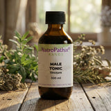 A bottle labeled "Male Tonic - 200/300ml" sits on a wooden table with herbs in the background, emphasizing natural testosterone support and prostate health.