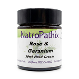 A jar of NatroPathix Rose & Geranium 30ml Hand Cream with a black lid and white label, ideal to pair with the Bounce Back Kit - Get Well Faster! for everyday wellness.