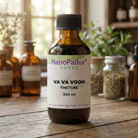A bottle of Va Va Voom Tincture (100/200/300ml) sits on a wooden table with herbs behind it, showcasing its adaptogenic properties and natural energy-boosting benefits.