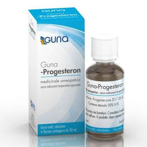 A bottle of Guna Progesteron homeopathic medicine beside its Italian-labeled box, formulated to help regulate the menstrual cycle and support balanced progesterone signaling.