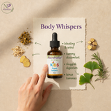 A hand points toward a small amber dropper bottle labeled NatroPathix Kids Digest Support, placed on a beige paper sheet with the title 'Body Whispers' and herbal ingredients around it.