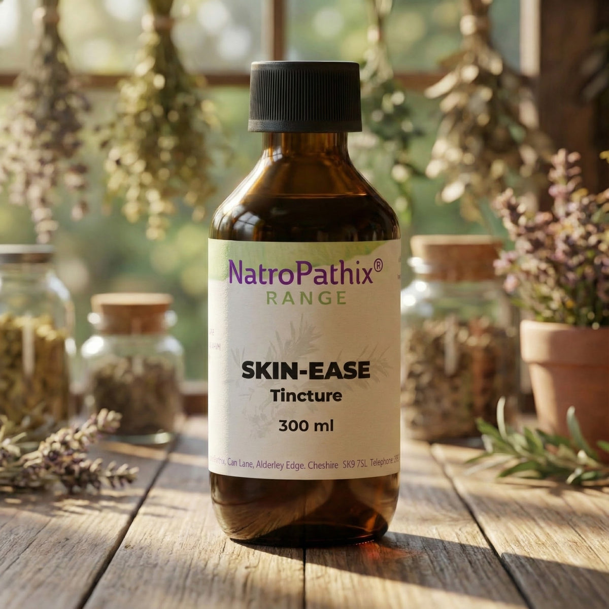 A brown bottle of Skin-Ease Tincture - 200/300ml sits on a rustic table with herbs, showcasing this herbal blend made to cleanse blood and support healthy skin.